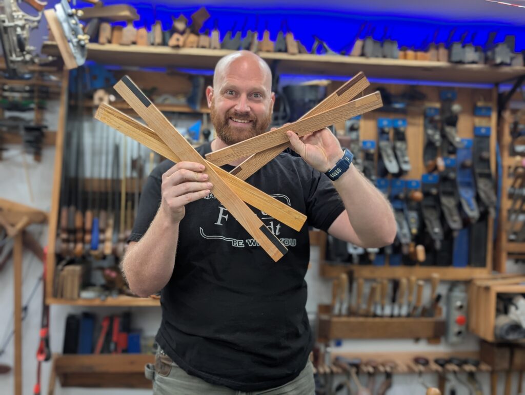 Plane Wellness Course picture of James Wright holding Winding Sticks