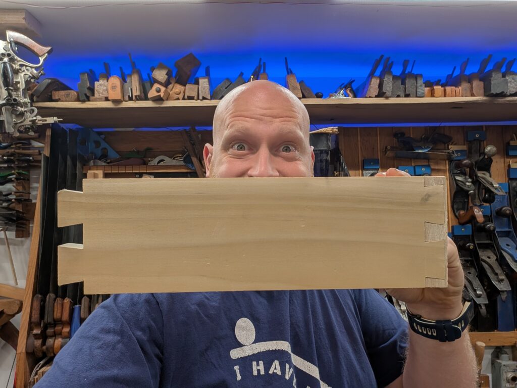 Picture of James Wright holding a set of dovetail boards