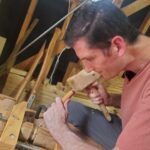 Ryan Barnard using a woodworking chisel